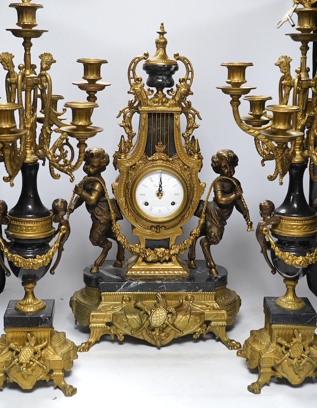 A bronze and marble three piece clock garniture, key, no pendulum, 69cm. Condition - good, not tested as working